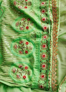 A green party wear sharara with dupatta