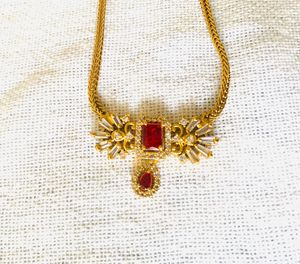 Elegant Gold Necklace with Red Stone