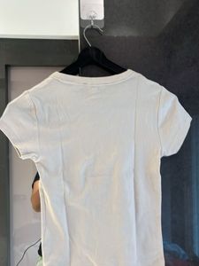 Cream T-Shirt with Red Bow Design