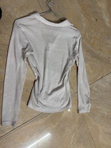 white collered full sleeve workout top