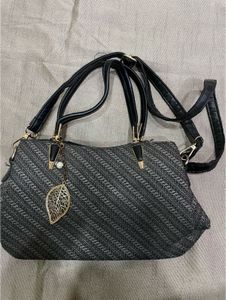 Stylish Textured Handbag with Leaf Charm