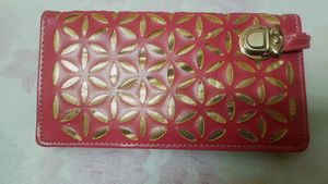 A beautiful pink and golden wallet