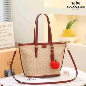 COACH* *TAXI TOTE BAG 21 IN SIGNATURE CANVAS*
