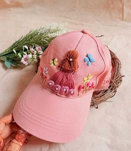 Hand-Embroidered Pink Cap with Doll Design