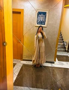 Elegant Tiered Gown with Cape