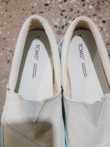 Classic White TOMS Slip-On Shoes