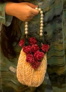 Unique Beaded Handle Clutch with Floral Accent