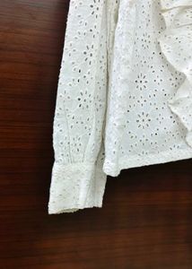 White eyelet ruffle long sleeve top