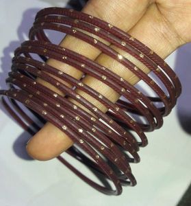 Set of Maroon Bangles with Gold Embellishments