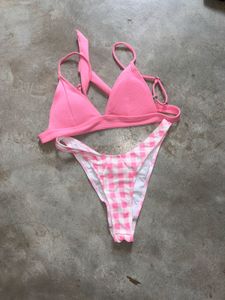 tri-bralette style bikini top and pink bot