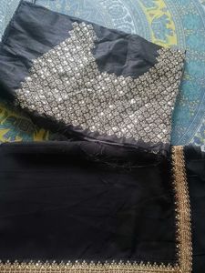 Elegant Black Saree with Golden Embellishments