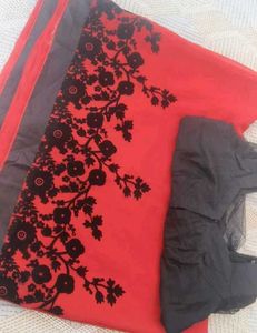 a beautiful red saree with blouse