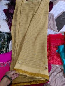 Elegant Cream Striped Saree with Embellishments