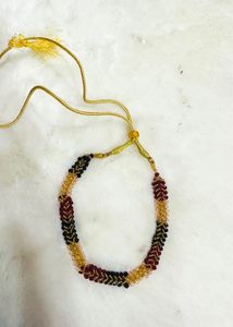 Multicoloured beaded neckpiece &amp; clutches