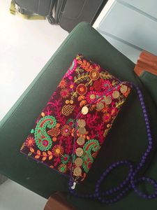 Embroidered Sling Bag.