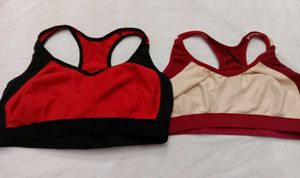 2 Racerback Sports Bras + brown handbag.