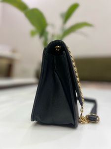 Chic Black Crossbody Bag with Chain Detail