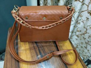 Chic Brown Crossbody Bag with Perforated Design