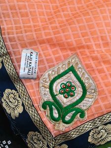 Elegant Peach Saree with Floral Border