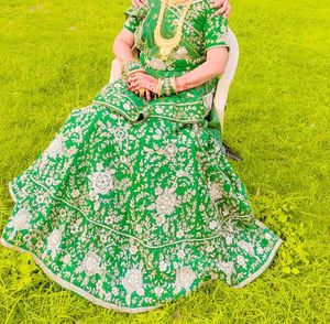 green lehanga eith blause and duptta jardoshi work