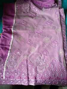 Georgette saree eith blouse..border and design...Pink in colour..