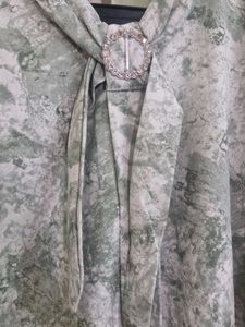 Elegant Green Printed Blouse with Embellished Coll