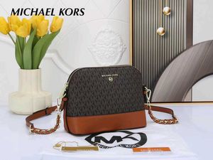 MICHAEL KORS* *MEDIUM LOGO DOME CROSSBODY SLING BA