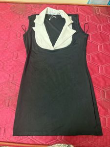 Sleek Black Dress with White Collar