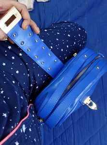 Vibrant Blue Handbag with Embellished Clasp