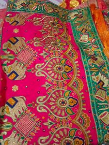 Vibrant Orange Silk Saree with Elephant Motifs