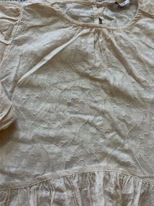 Cream Textured Peplum Top