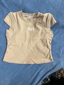 Cute Beige Sleeveless Top with Logo