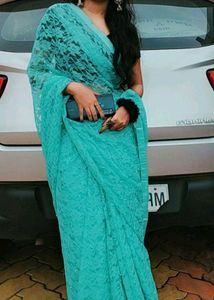 Stunning Teal Lace Saree with Pearl Embellishments