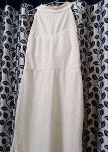 Fish tail gown with round neck.