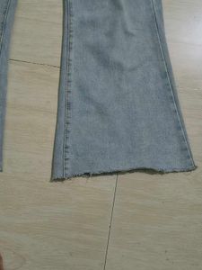 Light Wash Flared Jeans with Button Detail