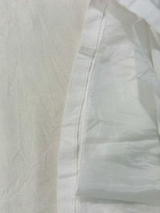 Chic White Mini Skirt with Grommet Detail