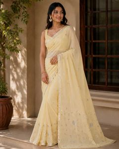 Elegant Cream Saree with Silver Embellishments