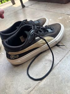 Puma Black &amp; Gold Sneakers