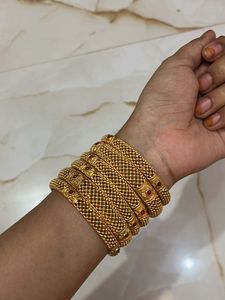 Set of 6 Gold Bangles with Red Stones