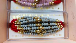 Elegant Red Beaded Rakhi 12 pc Set
