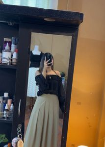 Off-Shoulder Ruffle Black Top with camel skir