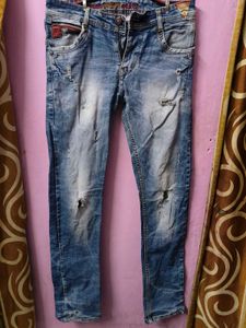 Distressed Blue Denim Jeans