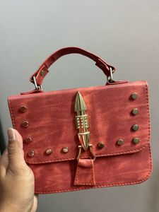 Stylish Red Crossbody Bag with Gold Embellishments