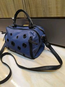 Stylish Blue Handbag with Eyelet Details