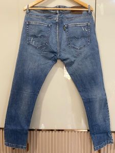 Distressed Denim Jeans