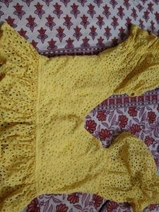 Yellow Eyelet Peplum Top
