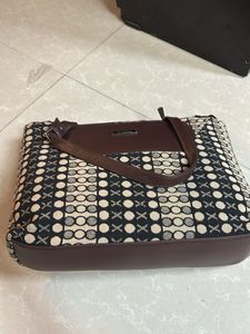 Chic Brown Handbag with Unique Pattern