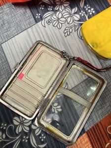 2 Clutches And 1 Handbag