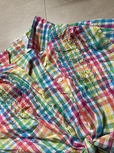 multicoloured shirt with a tie knot