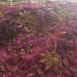 Silk type maroon saree with golden embroidery and